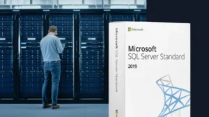 Microsoft SQL Server Standard 2019 product box in front of server room with racks; technician working on a rack