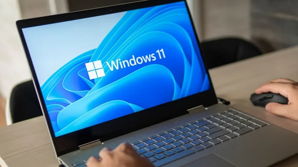 Laptop with Windows 11 start screen during setup and configuration