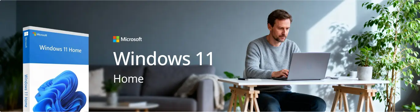 A man sits at a table using a laptop in a bright, modern room with plants. To the left, a Windows 11 Home software box and the text Microsoft Windows 11 Home are displayed.