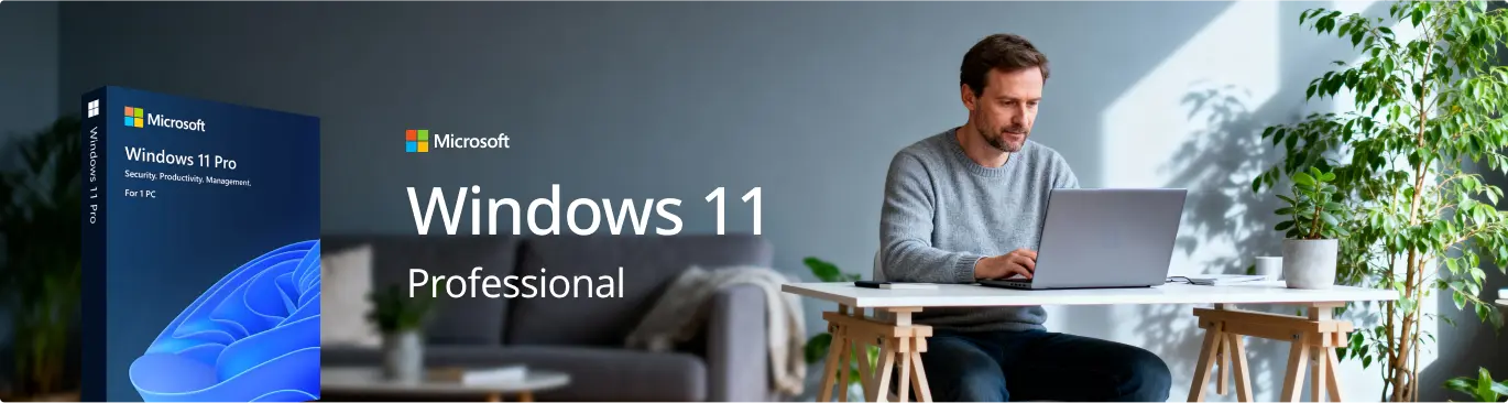 A man sits at a white desk using a laptop in a bright room with a large plant; next to him is a Windows 11 Pro box with text reading Windows 11 Professional.