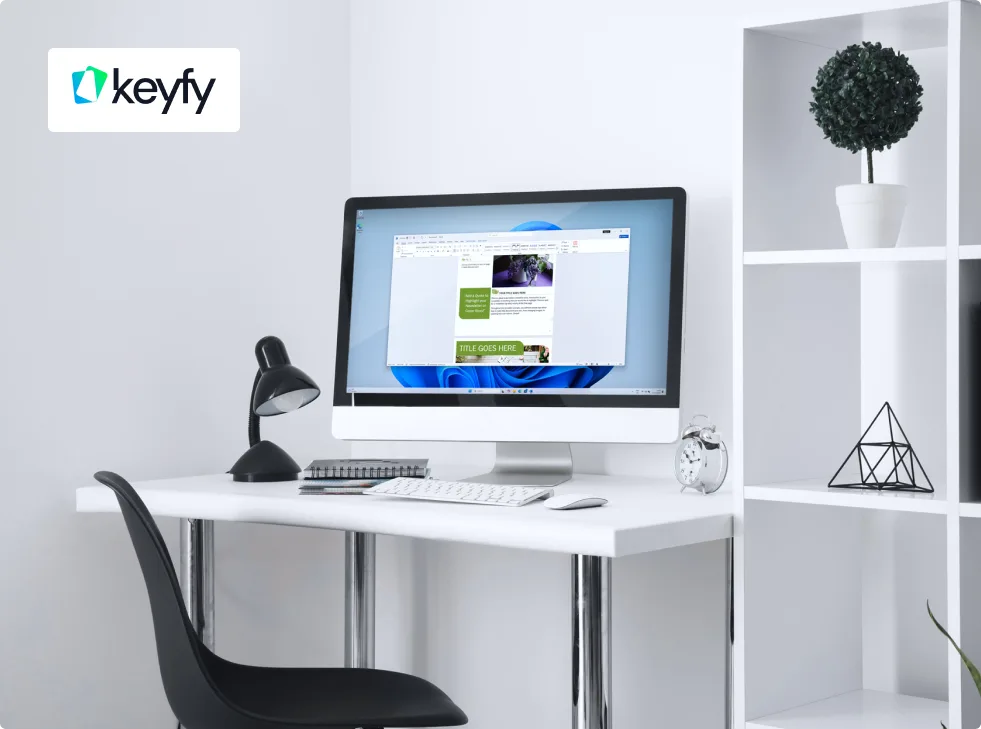 A minimalist white desk with a computer, keyboard, mouse, desk lamp, and alarm clock. A black chair is in front, and shelves with decor are on the right. The Keyfy logo appears in the top left corner.