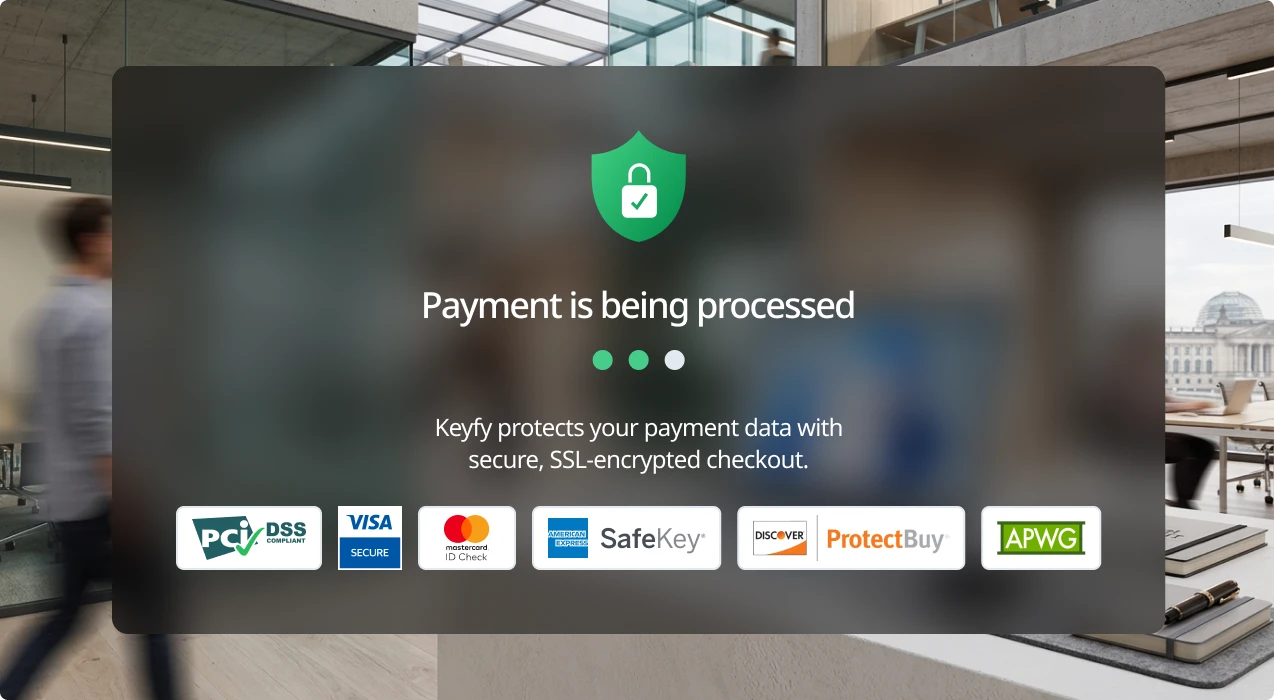 A payment processing screen shows a green shield icon with a lock and the message Payment is being processed. Logos for security and payment providers appear below, with a blurred office background behind the message box.