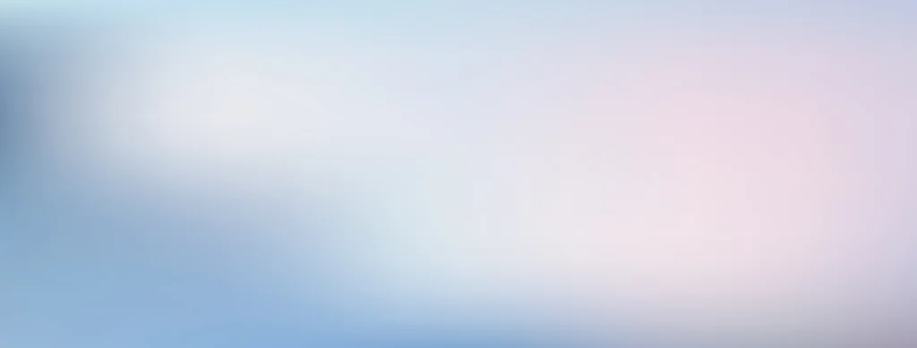 Soft, blurry gradient background with gentle shades of blue, white, and pink blending together smoothly. No distinct shapes or objects are visible.